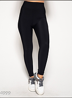 Демісезонні жіночі легінси з еластину на тонкому флісі у чорному кольорі.