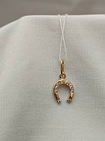 Золотий кулон підкова