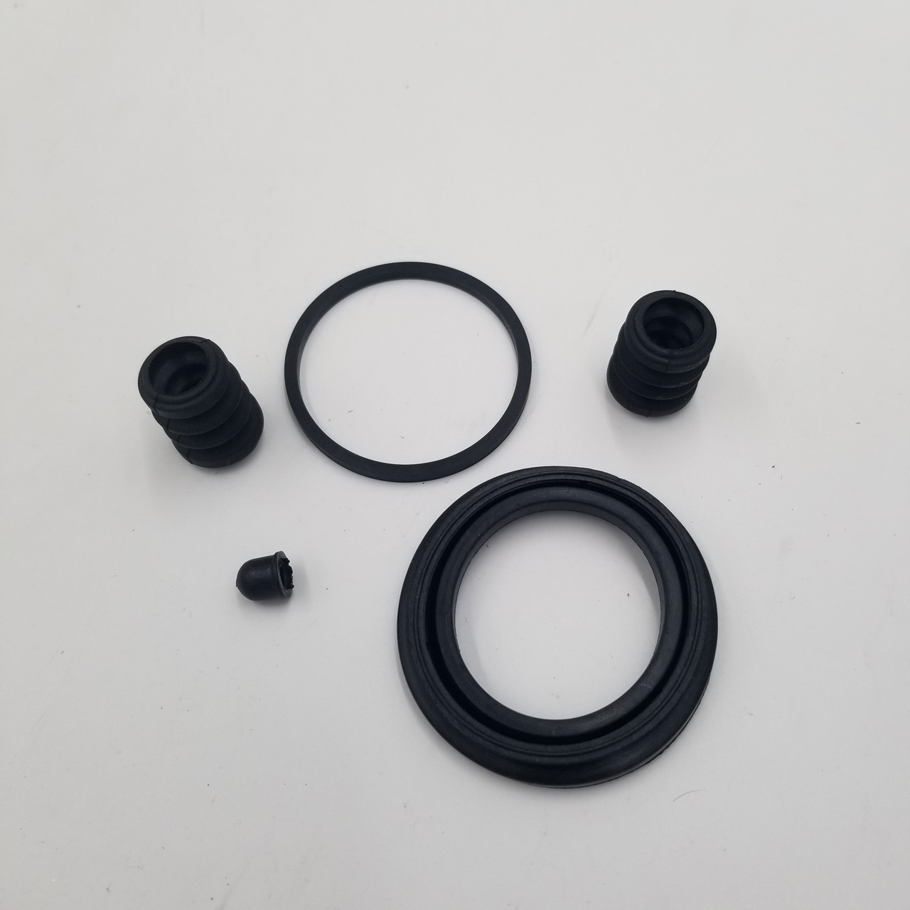 Ремкомплект супорта Авео (сальники+пильники 52 мм, 1 колесо) EuroEx Угорщина, фото 1