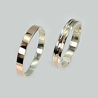 Пара срібних обручок із золотом