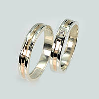 Пара срібних обручок із золотом