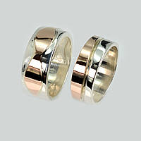 Пара срібних обручок із золотом