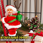 Музична іграшка Дід Мороз який​​​​​​​ піднімається по сходах з рухом вгору-вниз, фото 3