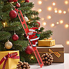 Музична іграшка Дід Мороз який​​​​​​​ піднімається по сходах з рухом вгору-вниз, фото 4