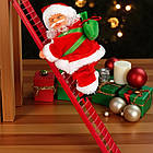 Музична іграшка Дід Мороз який​​​​​​​ піднімається по сходах з рухом вгору-вниз, фото 5