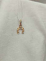 Золотий кулон підкова