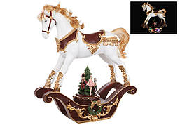 Новорічна керамічна фігура Конячка-гойдалка з LED підсвічуванням і музичною ялинкою яка обертається, на батарейках (3*AA), 37см