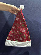 Новорічна шапка Санта Клауса з сніжинками