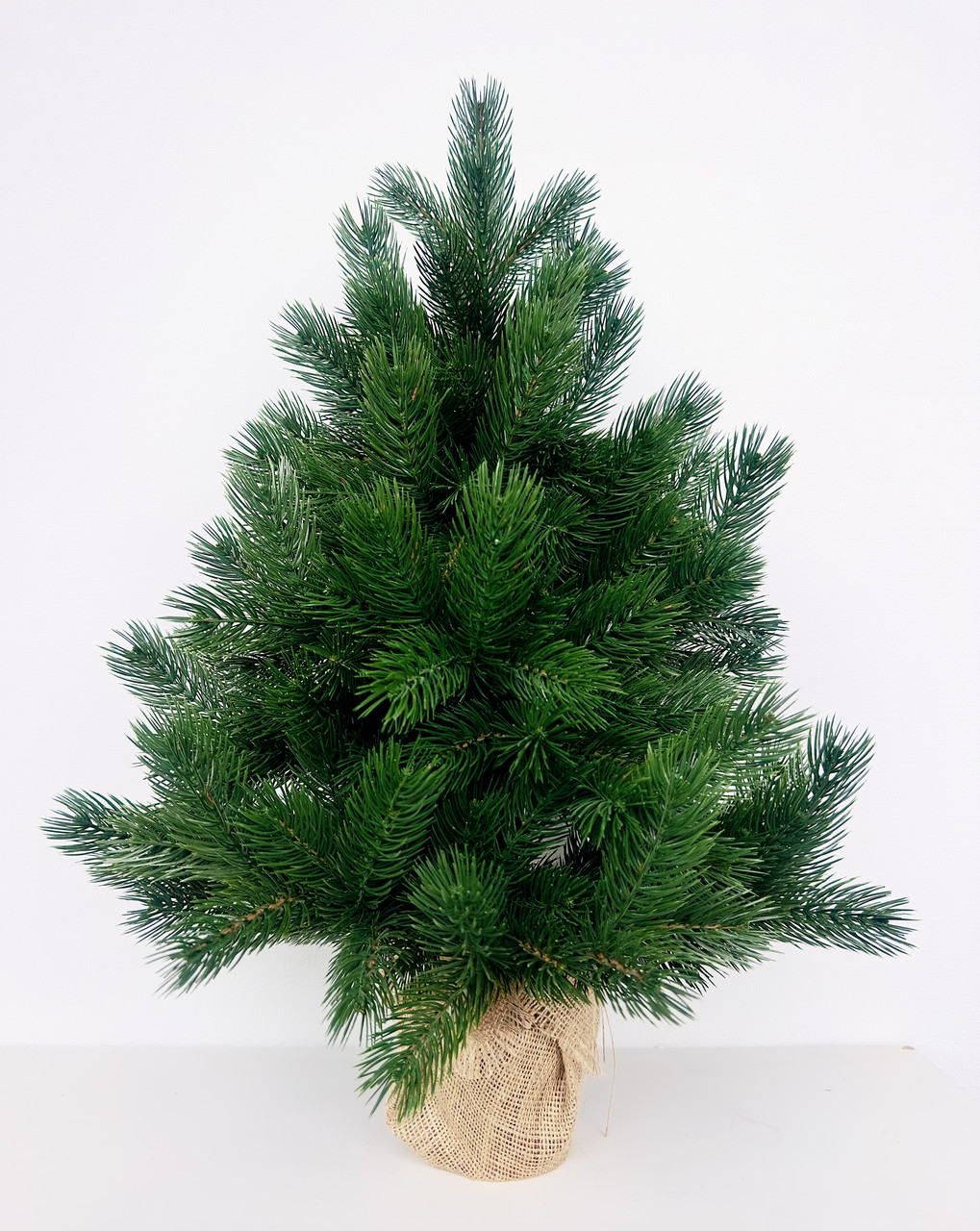 Ялинка новорічна штучна лита Pine Mini в мішковині 70 см зелена