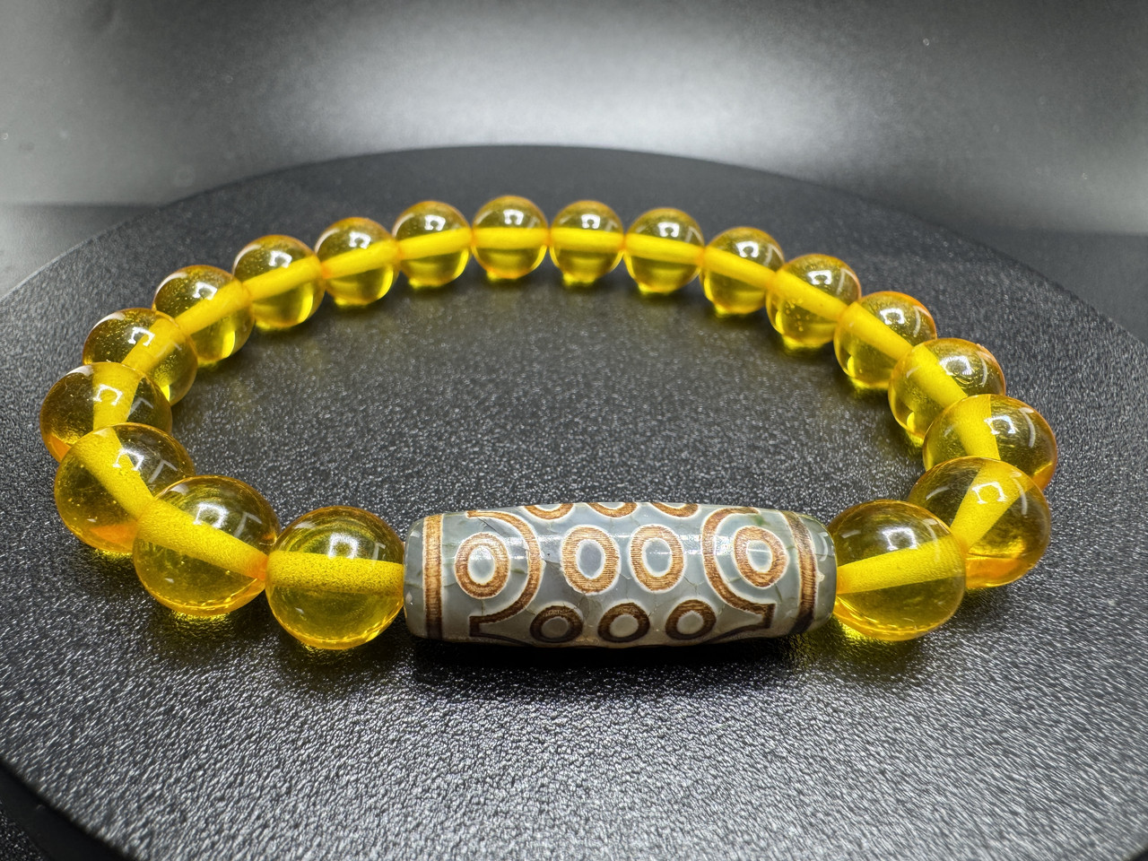 Браслет збільшує енергію власника — з бурштину та намистини ДЗІ 21 око, фото 1