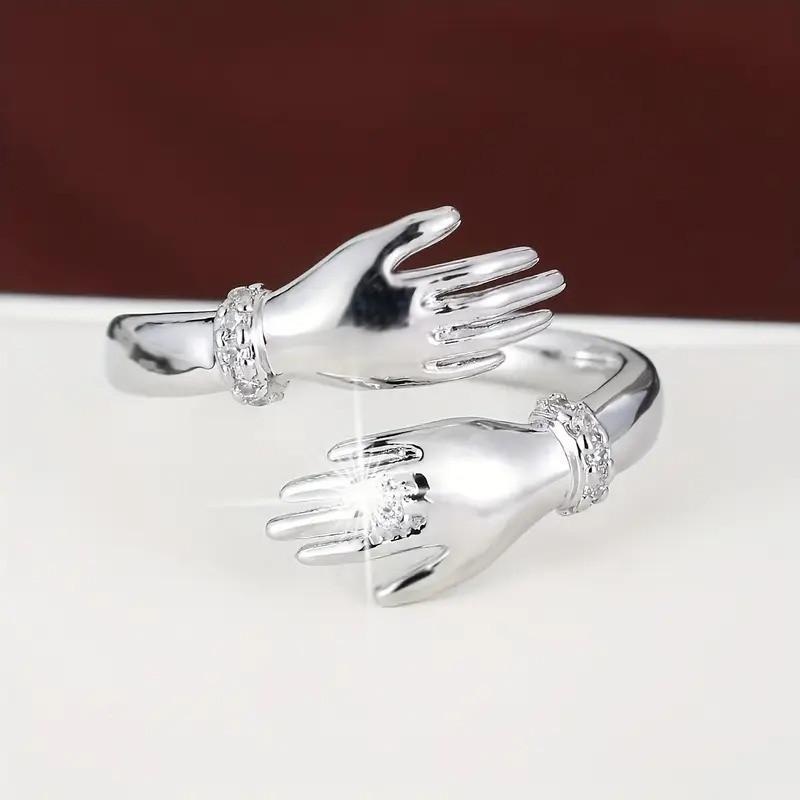 Каблучка срібляста жіноча руки з білими фіанітами обіймають палець регульована IgnisFlos412, фото 1