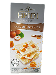 Білий шоколад Heidi з цілими карамелізованими лісовими горіхами 100 г