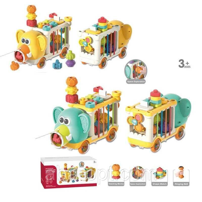 Каталка логічна YL 1303 (24) 2 види, “Слоник”, довжина 30 см, знімні колеса-брязкальця, спінер, гумові стрічки, пронумеровані, фото 1