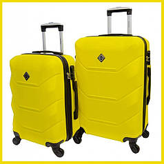 Набір валіз Bonro 2019 - 2 шт (M+L) середня і велика жовті дорожні пластикові на колесах з кодовим замком і висувною ручкою
