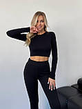 Утеплені чорні жіночі лосини з трикотажу в рубчик на флісі, фото 7