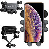 Гравітаційний тримач для автомобільних решіток