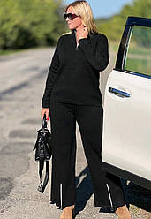 Костюм жіночий однотонний з штанами і кофтою 46/50