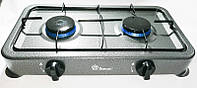 Газова плита настільна компактна з двома конфорками для приготування їжі на дачі вдома.