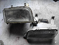 Фари та вказівники поворотів скло лівої фари Вольво Volvo 440 / 460 (1994-1996)