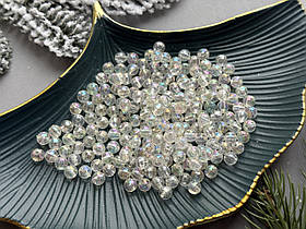 Намистини "Грані" 0.6 см прозорогомолочного кольору з переливом 50 гр