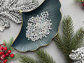 Намистини "Грані" 0.6 см прозорого кольору з переливом 50 гр