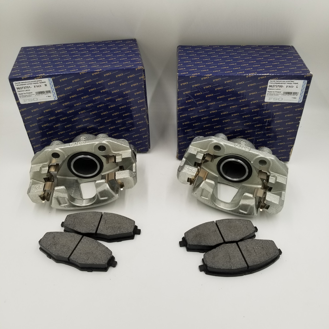 Супорта Ланос, Сенс, Нексия (комплект лівий + правий + колодки) FSO Польща 96273700, 96273701