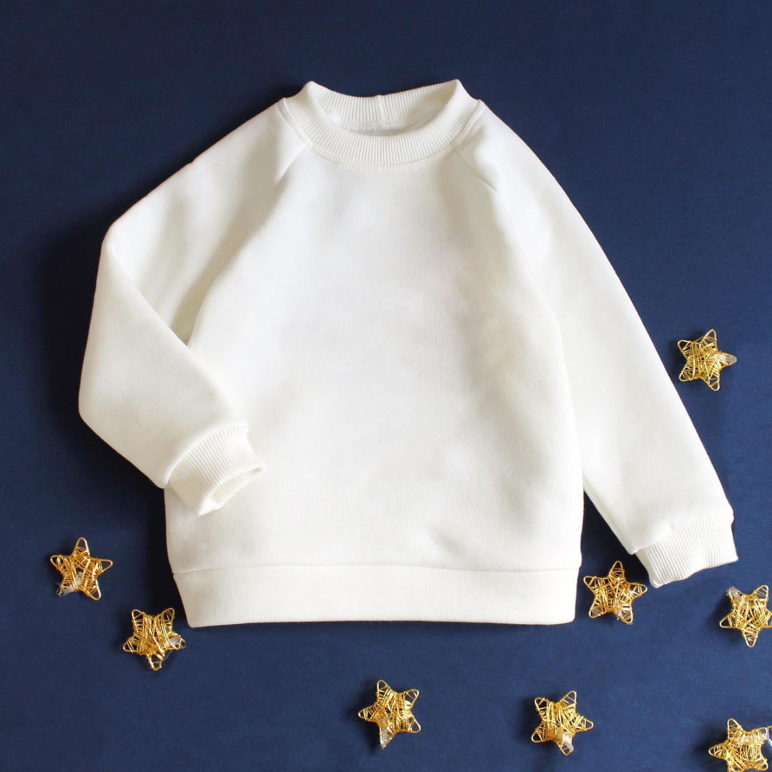 Дитячий світшот молочного кольору утеплений однотонний з рукавом реглан з тринитки з начісом розміри 92–140