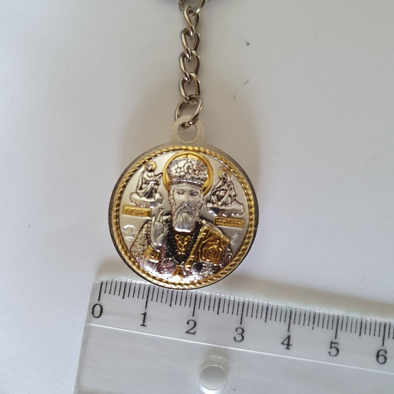 

Брелок икона серебряная Николай Чудотворец с позолотой круглый, Серый