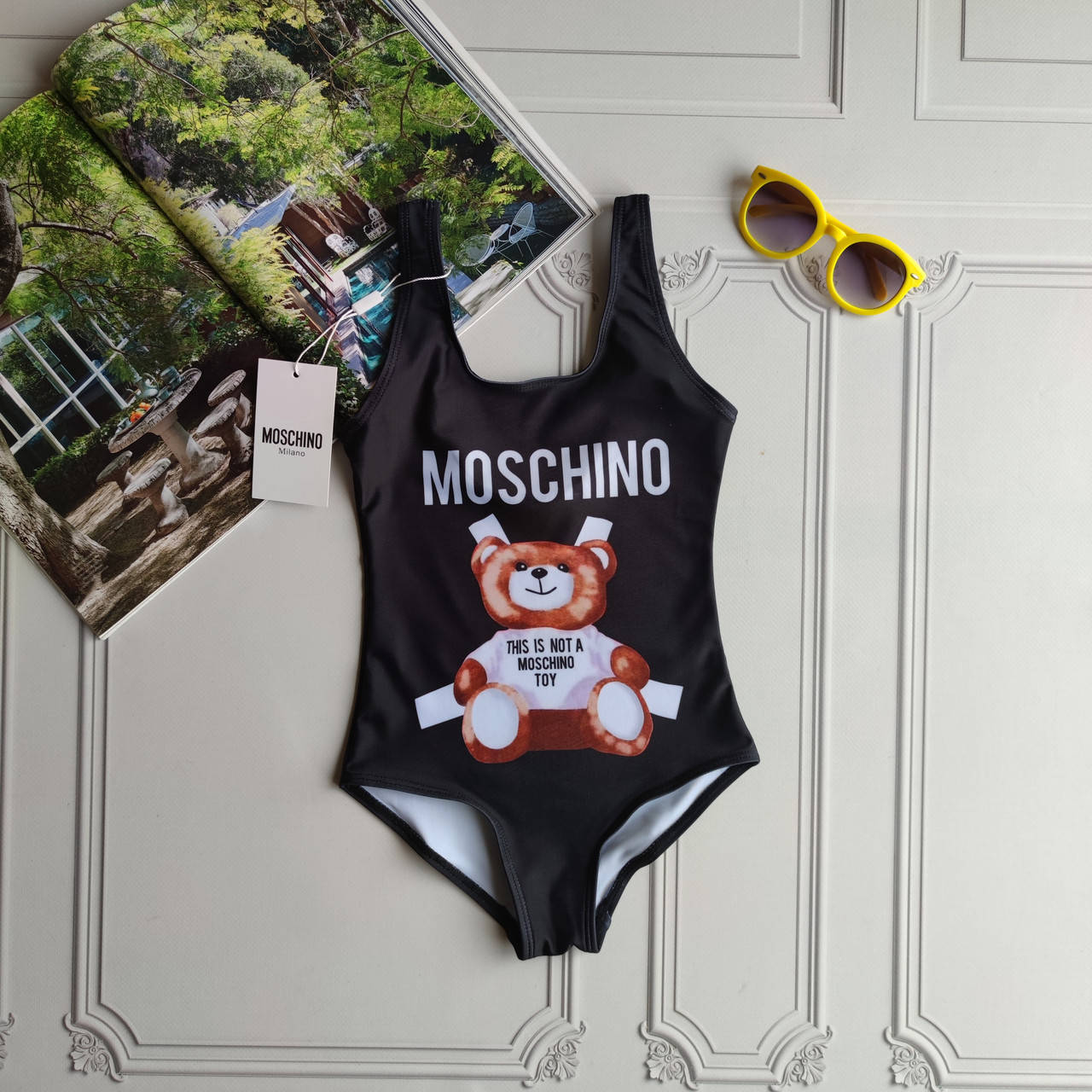 

Детский черный цельный купальник боди Moschino