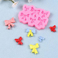 Силіконовий молд Бантики 80 на 60 мм рожевий