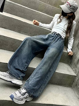 Модні широкі джинси для дівчинки підлітка