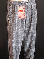 Клітчасті жіночі штани з кишенями на блискавці