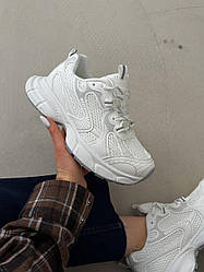 Білі кросівки
