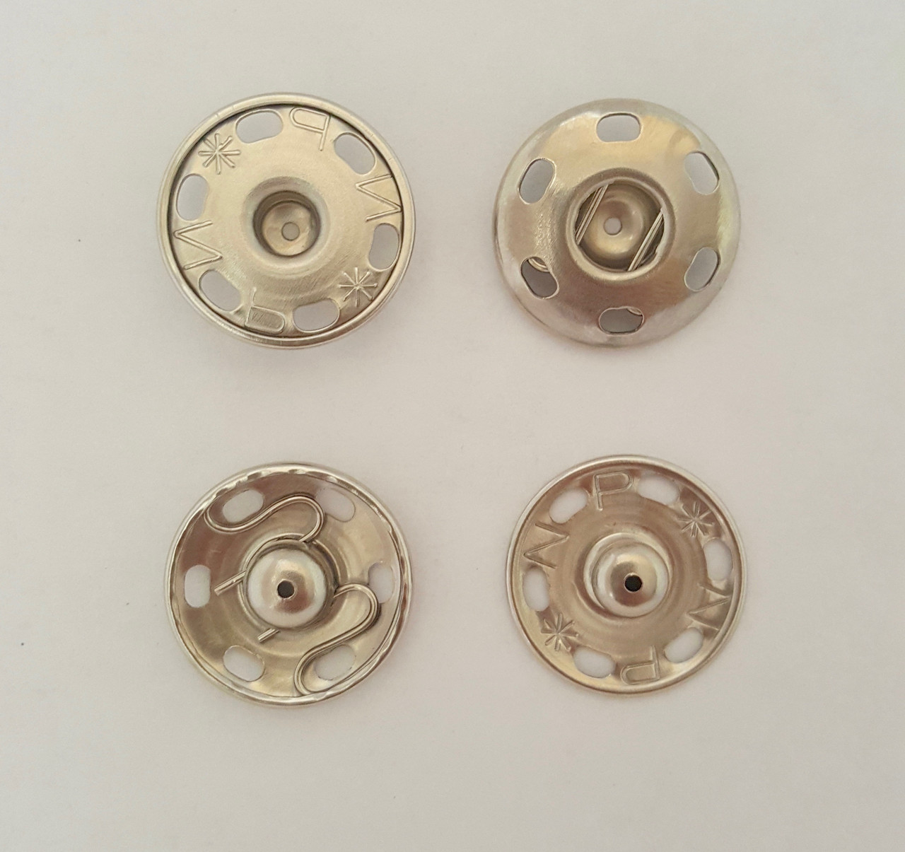 Кнопки 21 мм пришивні круглі