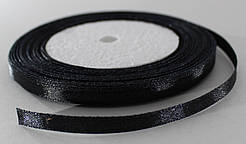 Стрічка атласна. Колір чорний. Ширина — 0,6 см, довжина — 23 м