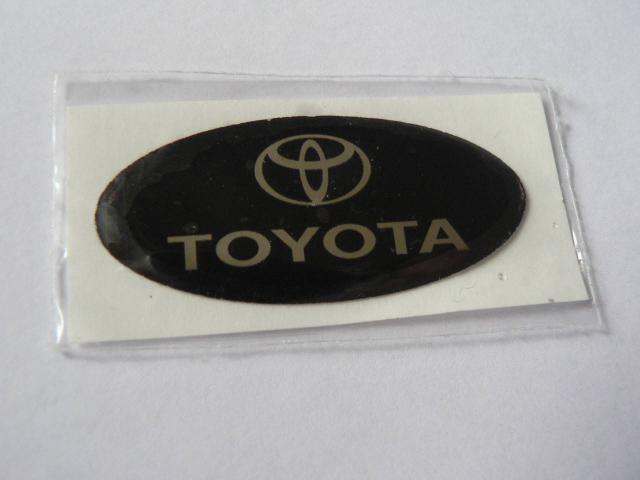 

Наклейка s надпись овал Toyota 45х20х1.2мм силиконовая эмблема логотип марка бренд на авто Тойота, Черный