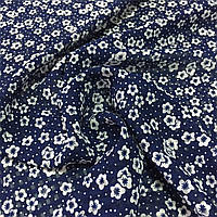 Шифон-органза з маленькими білими квіточками на темно-синьому тлі