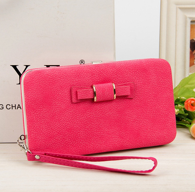Рожевий жіночий гаманець клатч із бантиком