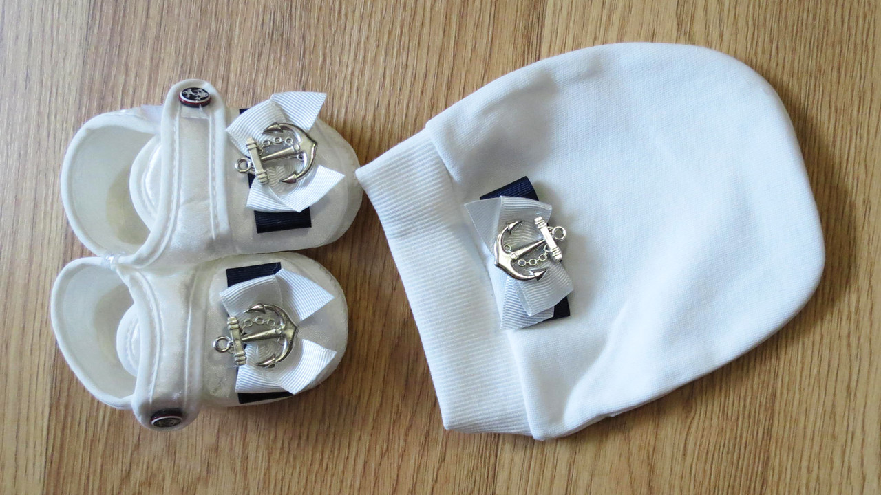 Набір для новонароджених пінетки і шапочка