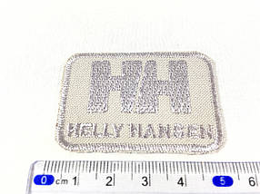Нашивка HELLY HANSEN колір світло-сірий 50x35 мм