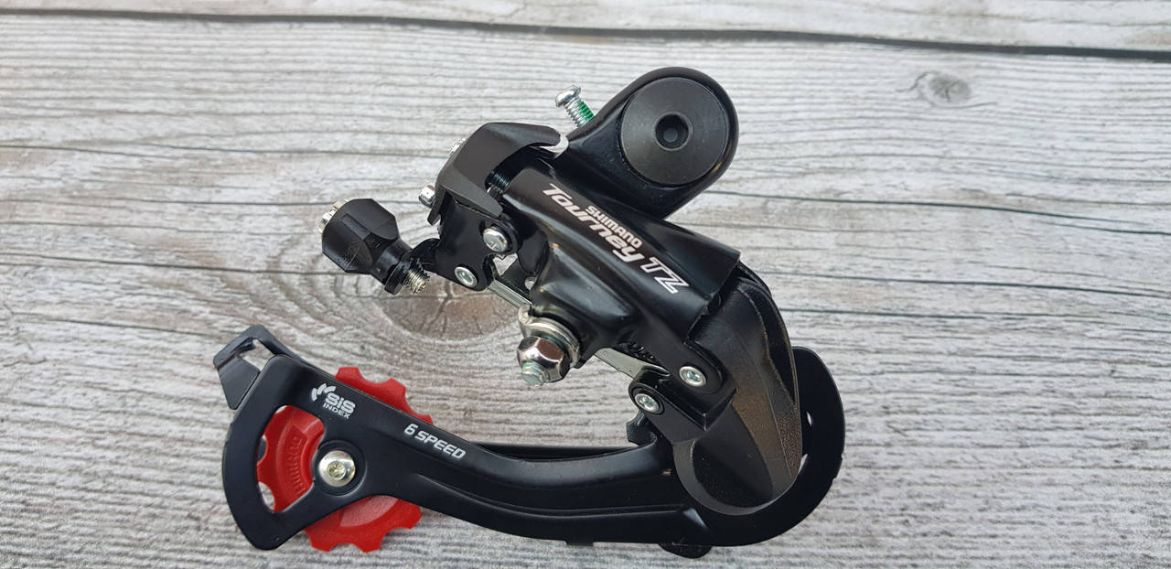 

Переключатель задний Shimano Tourney TZ 6 и 7 звёзд