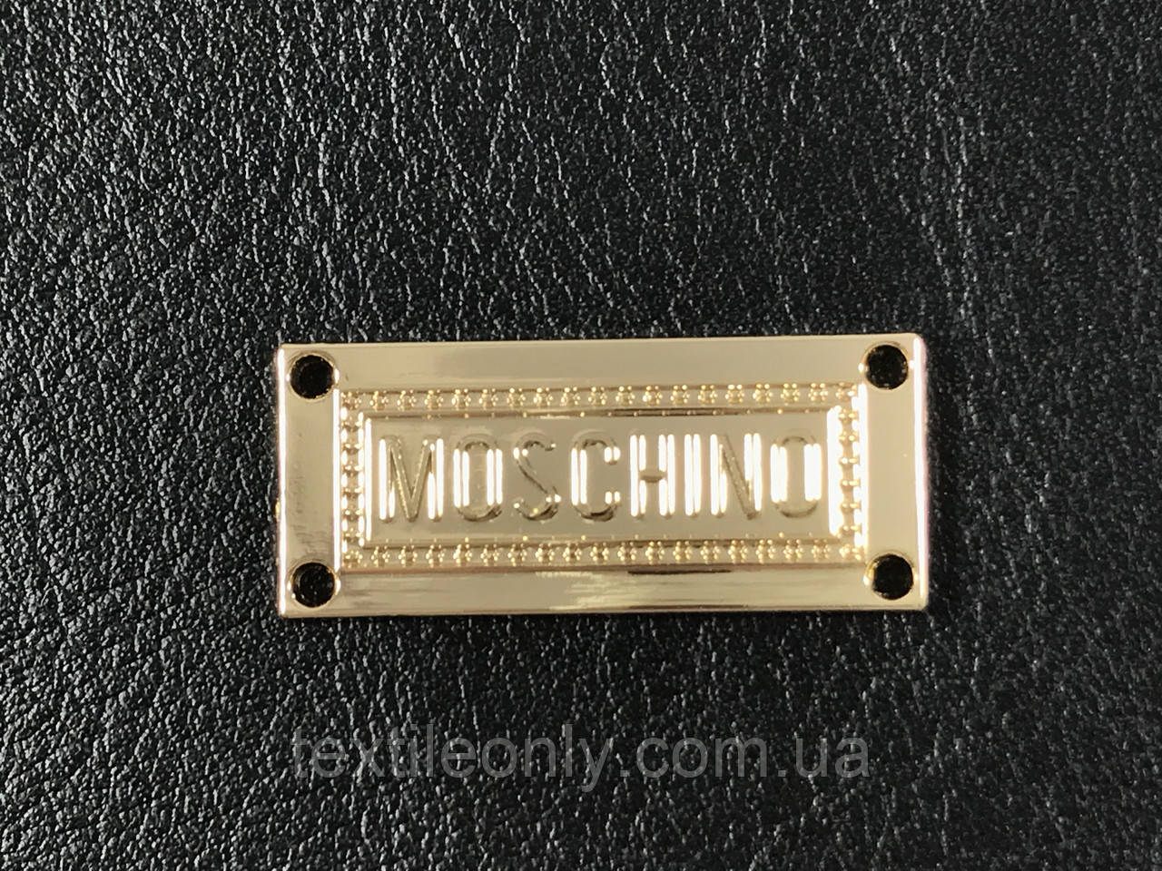 Пришивная металлическая эмблема Moschino 29х13мм - фото 1 - id-p603559530