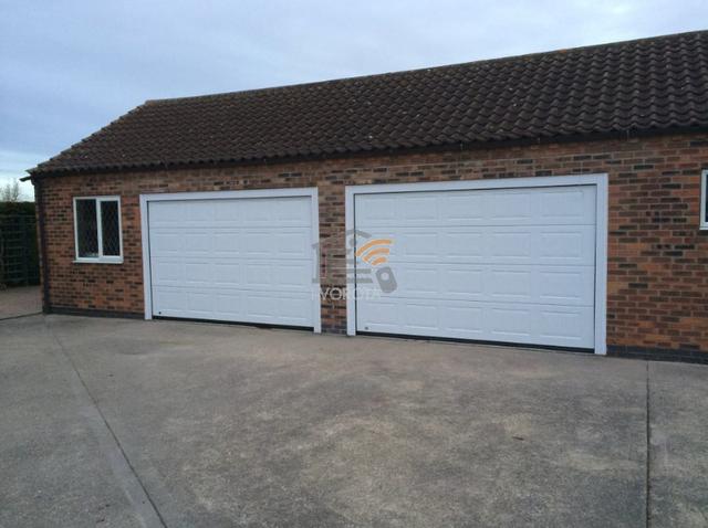 секционные ворота алютех видео