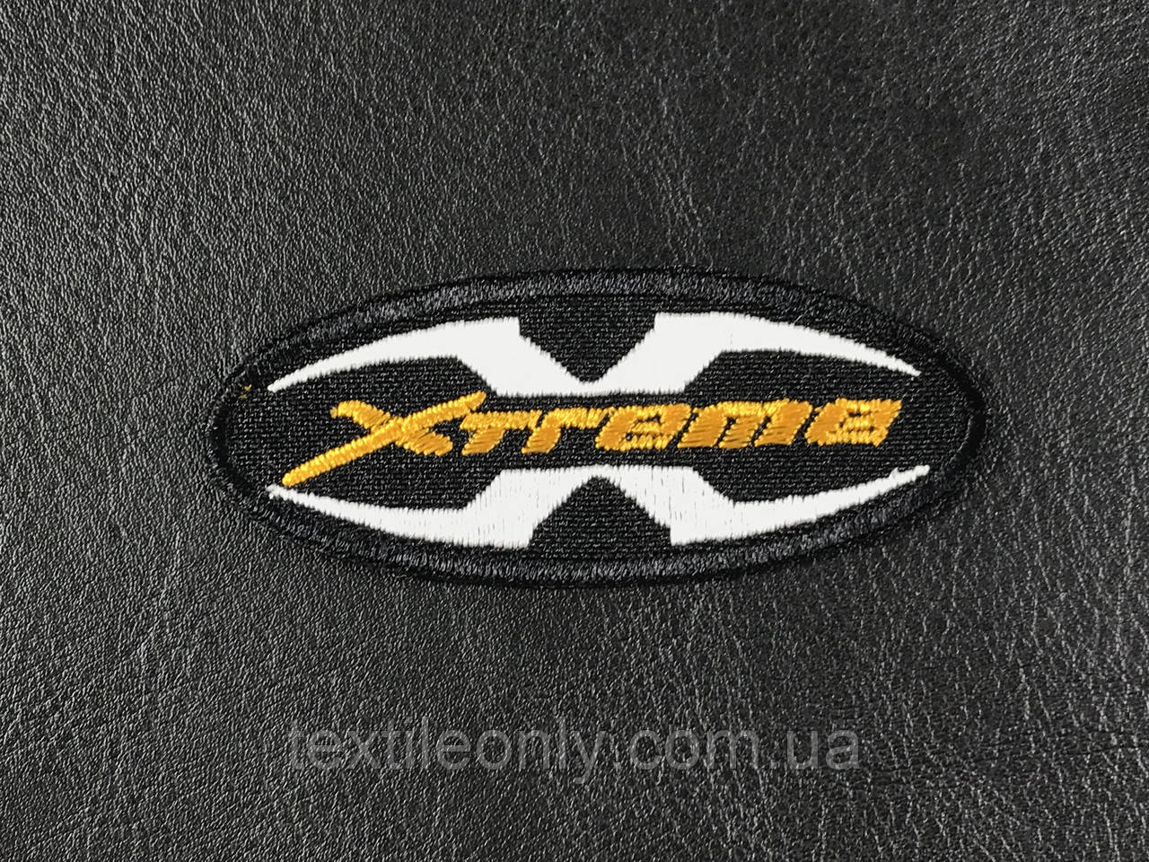 Нашивка Xtreme колір чорний жовтогарячий 70x30 мм