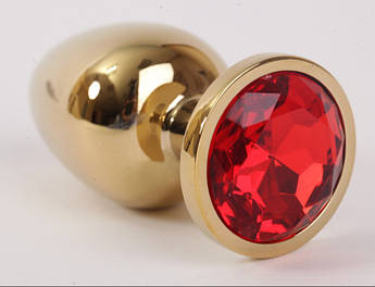 Золота анальна пробка з червоним кристалом у чохлі 2.8*7 см Металева