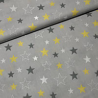 Хлопковая ткань польская звезды серые, белые, желтые, большие и маленькие на сером (E-358)