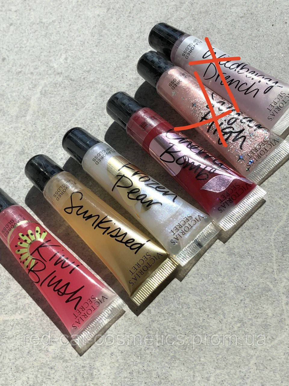 

Блеск для губ Victoria's Secret.