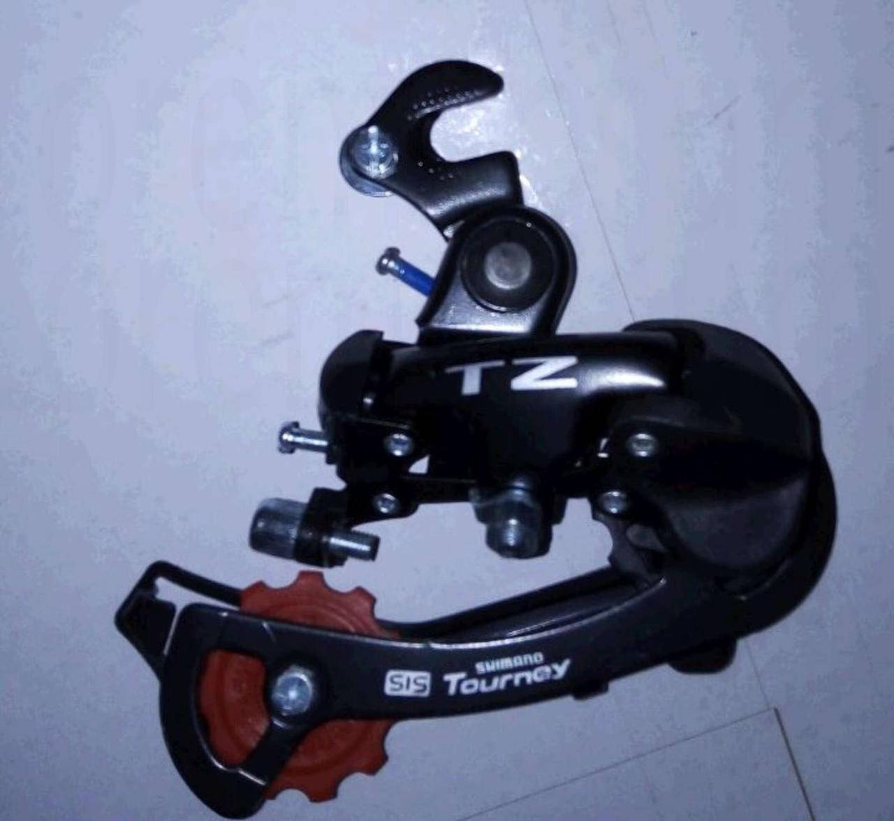 

Переключатель скоростей велосипеда задний (крепеж на ось) (TZ50) (Shimano) YKX