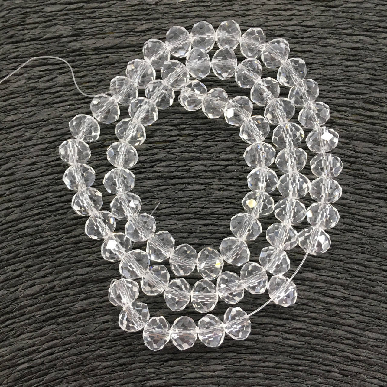 

Бусины на нитке Стекло рондель d=8мм цвет белый прозрачный (~72 бусины на на нитке)