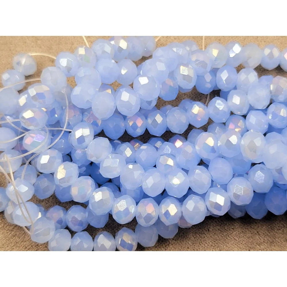 

Бусины хрустальные (Рондель) 6*4 мм, пачка 90-95 шт, цвет - голубой с переливом матово-прозрачный